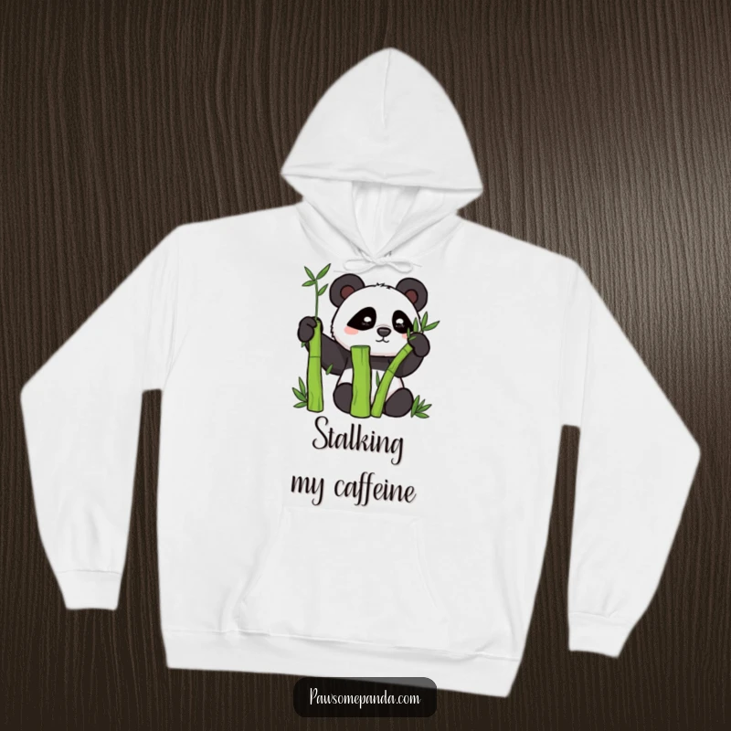 Funny hoodie with a mischievous panda character cleverly hidden behind a thick bamboo stalk.