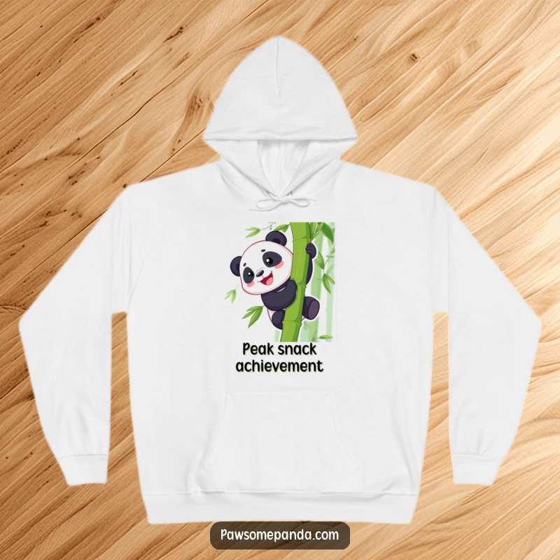 Funny hoodie depicting a cheerful panda with a big grin, expertly climbing a bamboo stalk, radiating fun and determination.