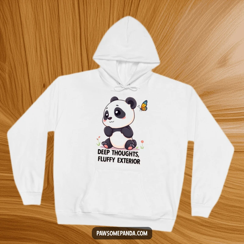 Funny hoodie with a panda character tilting its head curiously, watching a delicate butterfly flutter by.
