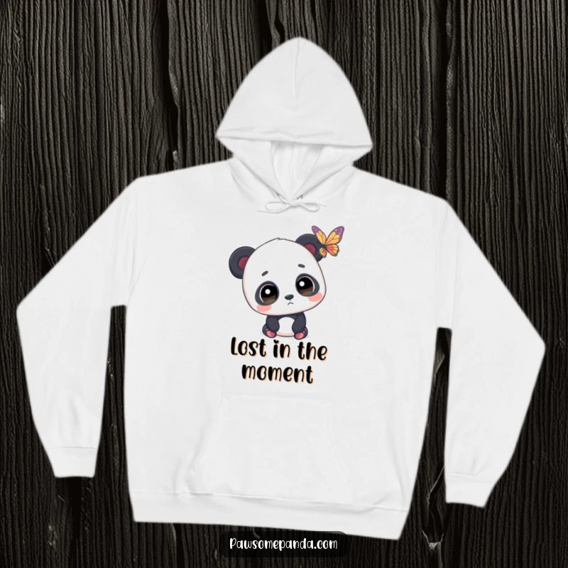 Funny hoodie featuring a panda with wide, spellbound eyes watching a butterfly, creating a sense of gentle wonder.