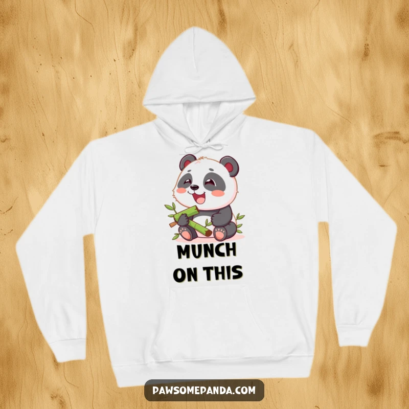 Funny hoodie featuring a kawaii panda cub contentedly munching on bamboo, perfect for cozy days and happy moments.