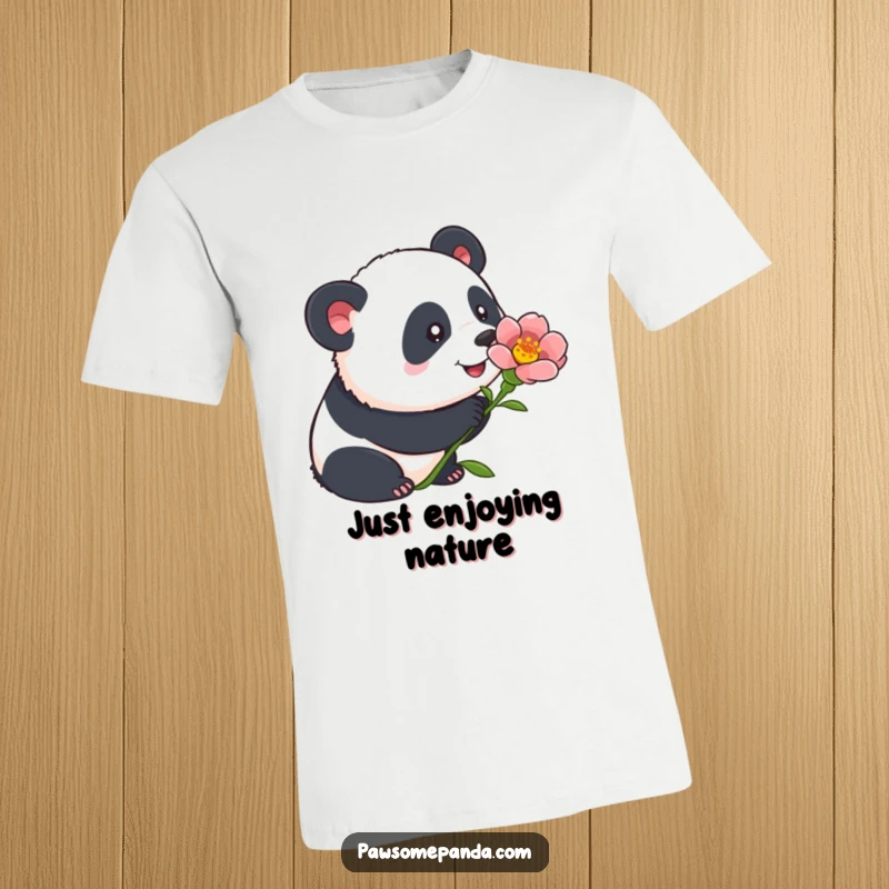 Funny panda t-shirt featuring a charming illustration of a panda curiously sniffing a vibrant flower, with its ears perked attentively.