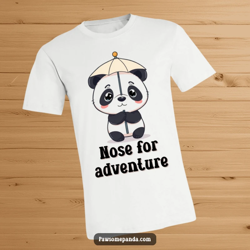 Funny t-shirt depicting a small panda with resolute eyes, expertly balancing a miniature umbrella on the tip of its nose.