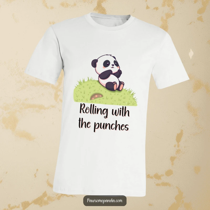 Funny t-shirt showcasing a joyful panda character tumbling down a lush grassy hill with a carefree, playful expression.